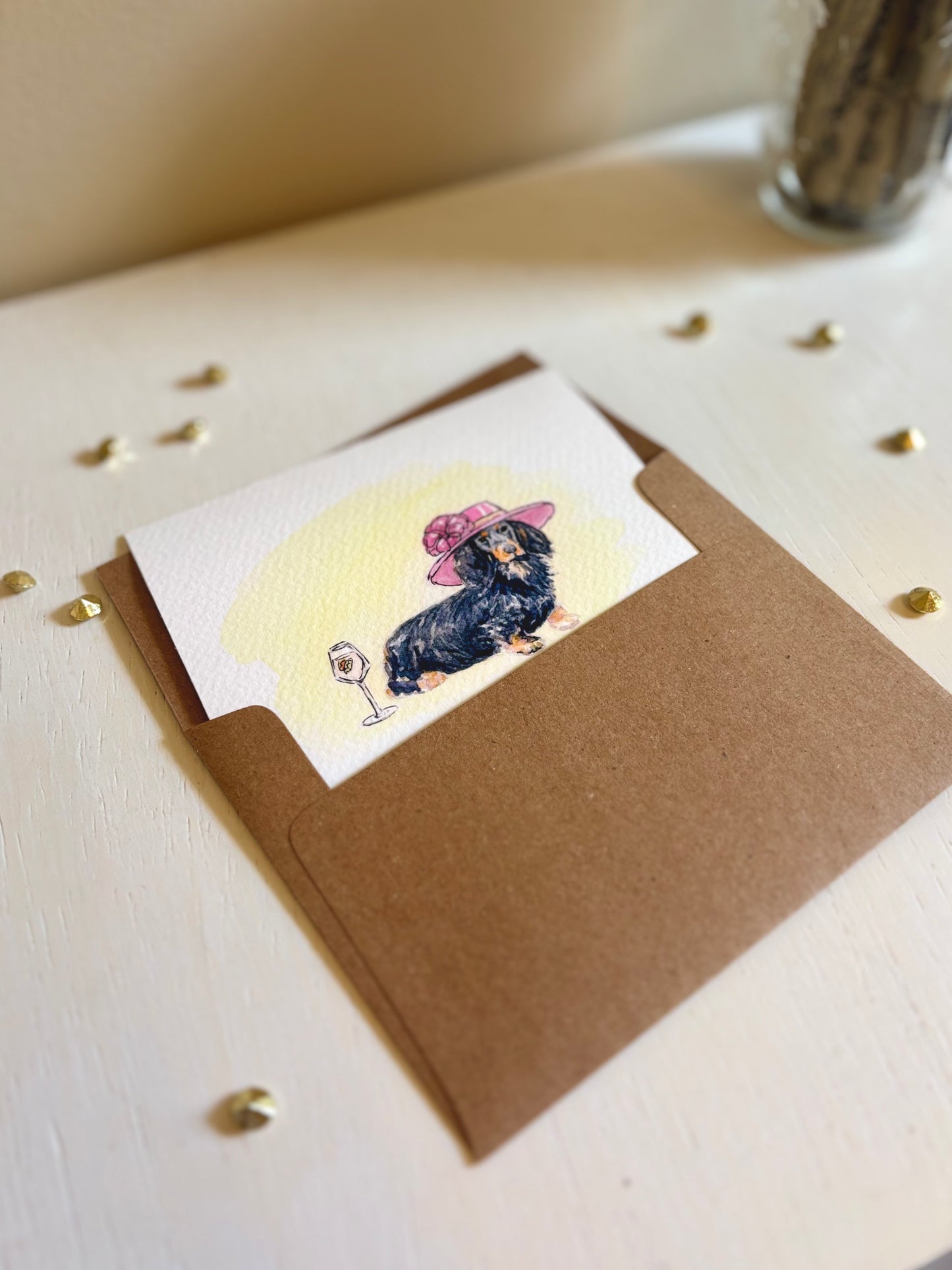 Greeting card with a Dachshund illustration on a brown envelope. 