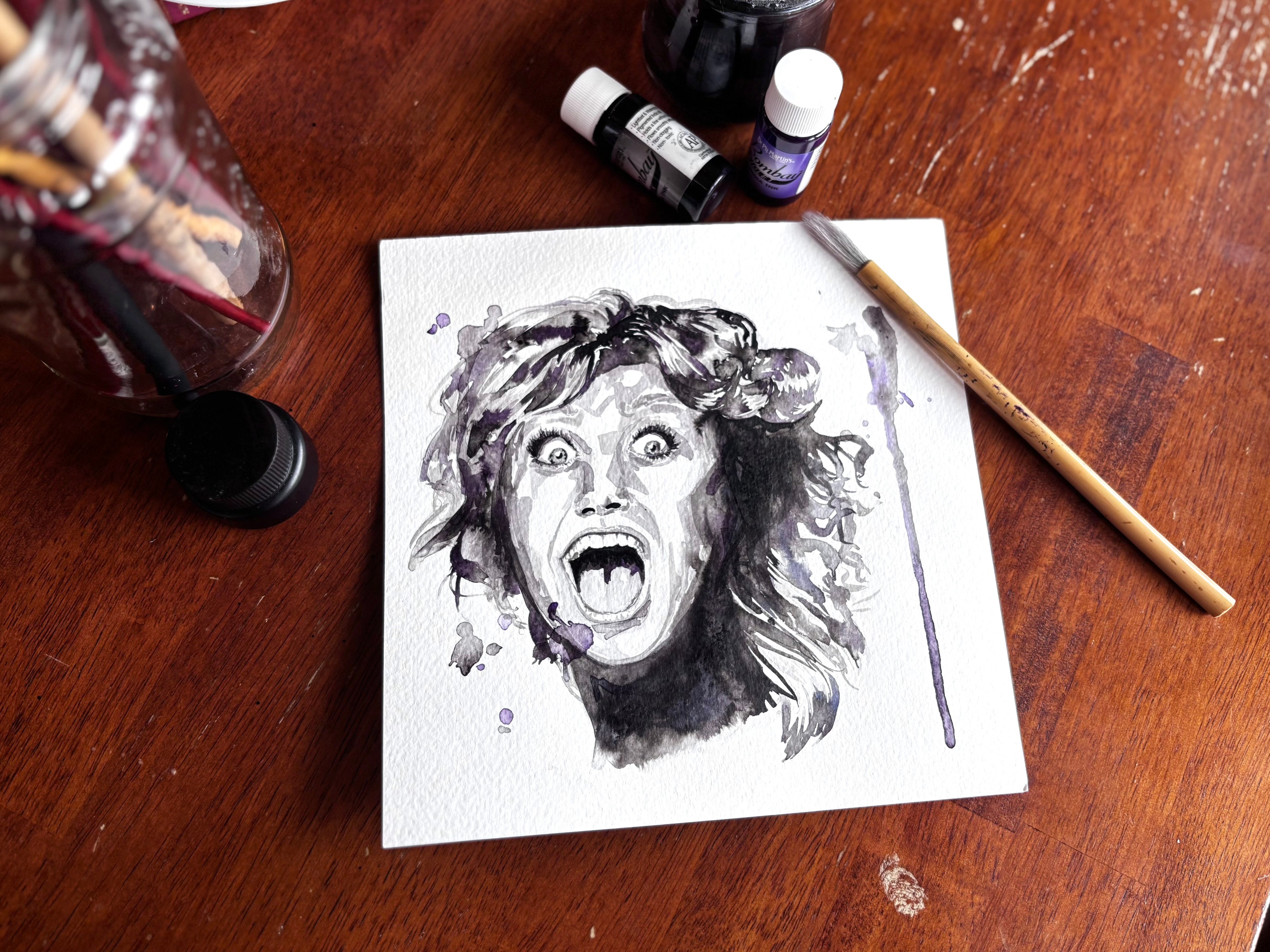 Stylized watercolor/India ink portrait of a woman.